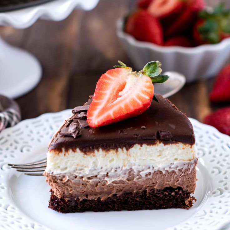 a slice of chocolate cake with strawberries on top