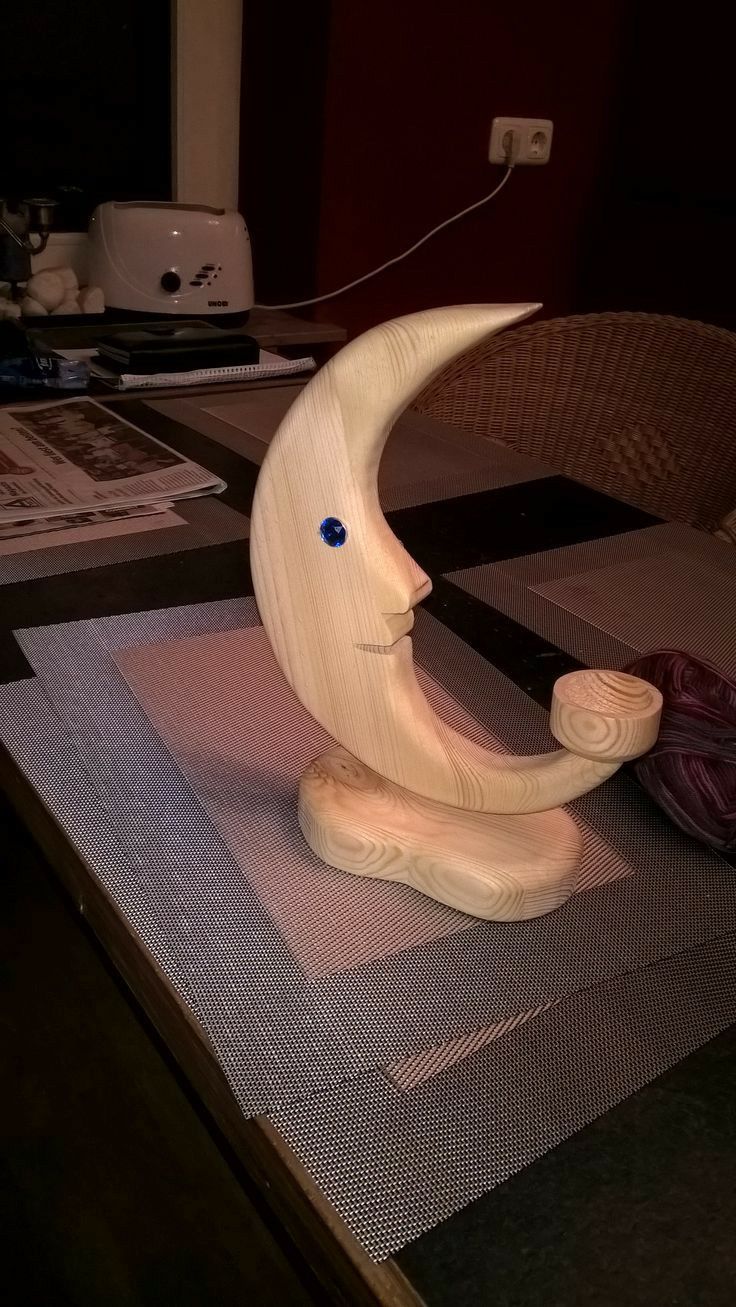 a wooden moon sitting on top of a table