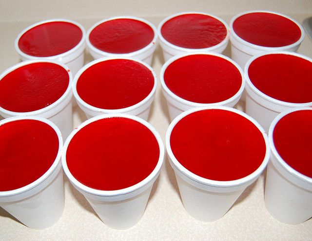 red and white cups sitting on top of a counter