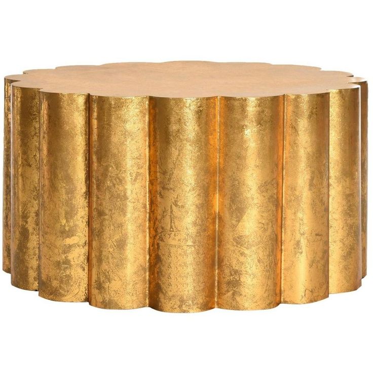 a gold coffee table with four sections on each side