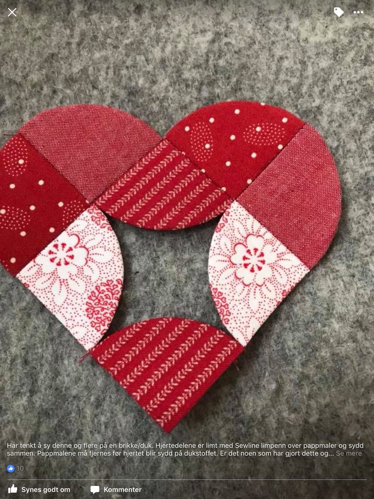 the heart is made out of red and white fabric