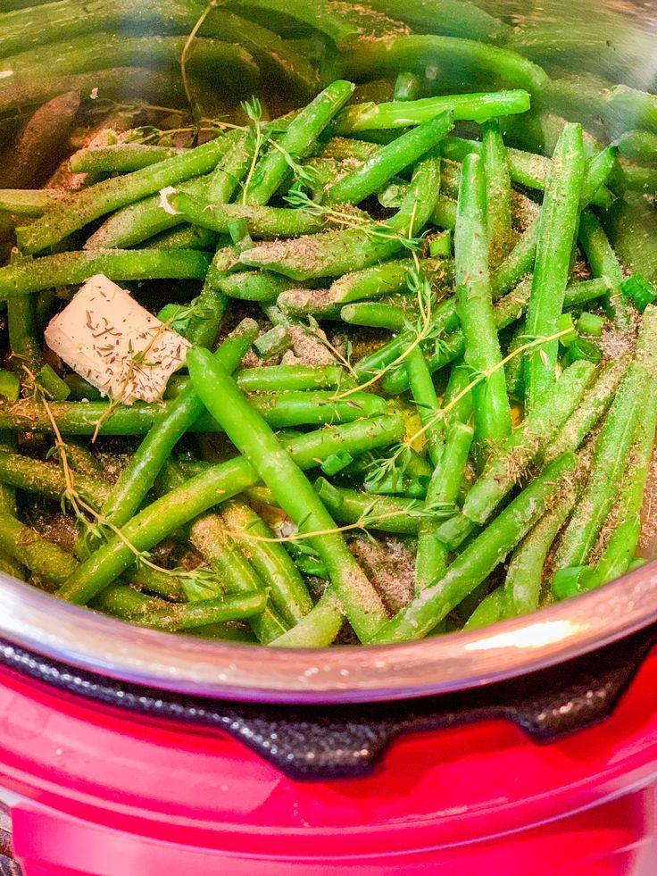 green beans are being cooked in a pot