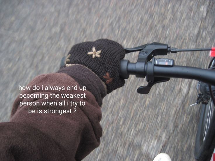 a person riding a bike with a hat on it's head and the words, how do i always end up becoming the weak person when all try to be strongest?