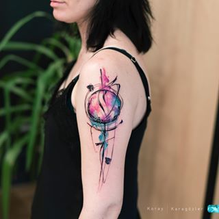 a woman with a colorful tattoo on her arm