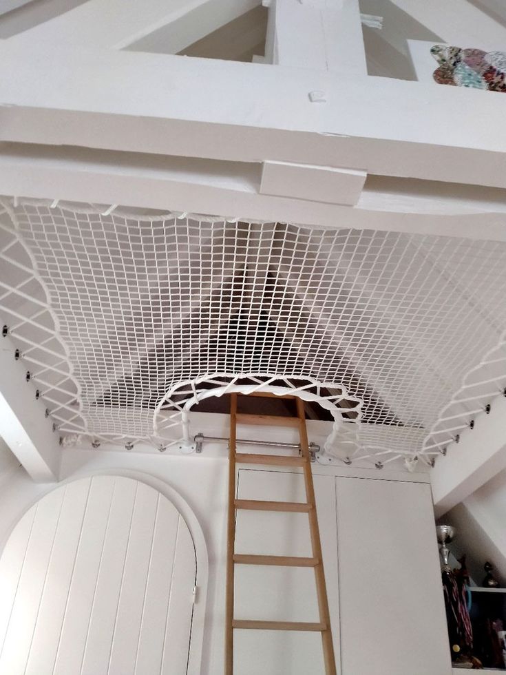 a ladder is hanging from the ceiling above a closet