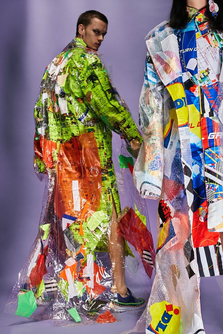 two people standing next to each other wearing colorful clothing