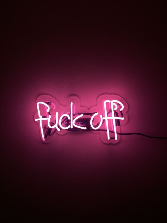 a neon sign that says fucko off