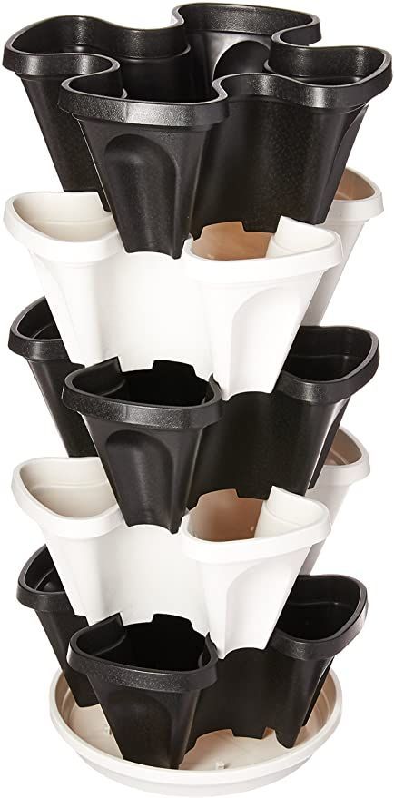 black and white plastic cups stacked on top of each other