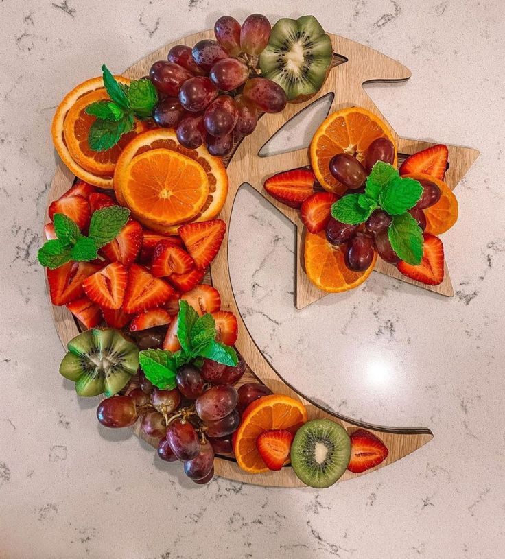 fruit arranged in the shape of a crescent