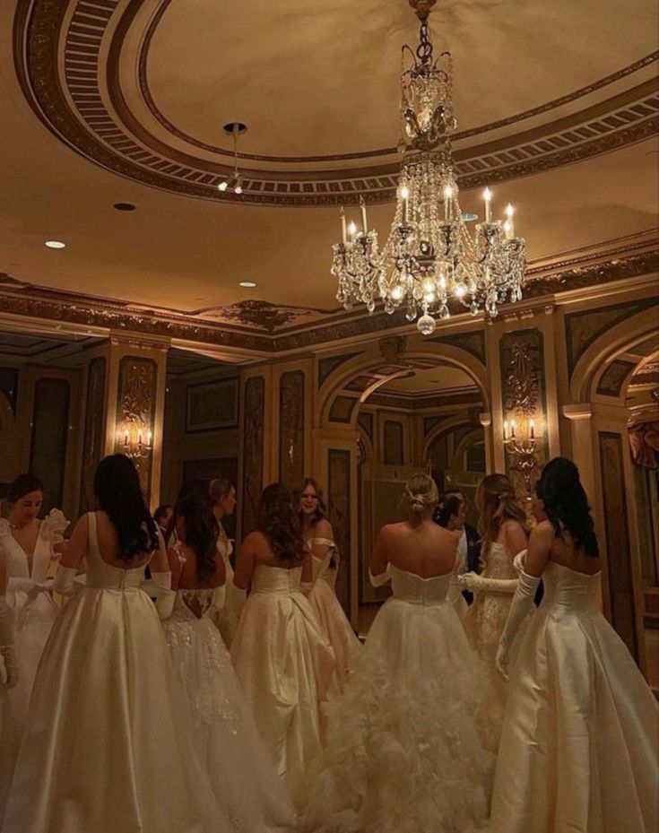 the bridesmaids are getting ready to walk down the aisle in their wedding gowns