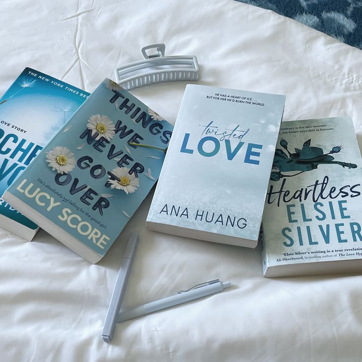 there are three books on the bed together