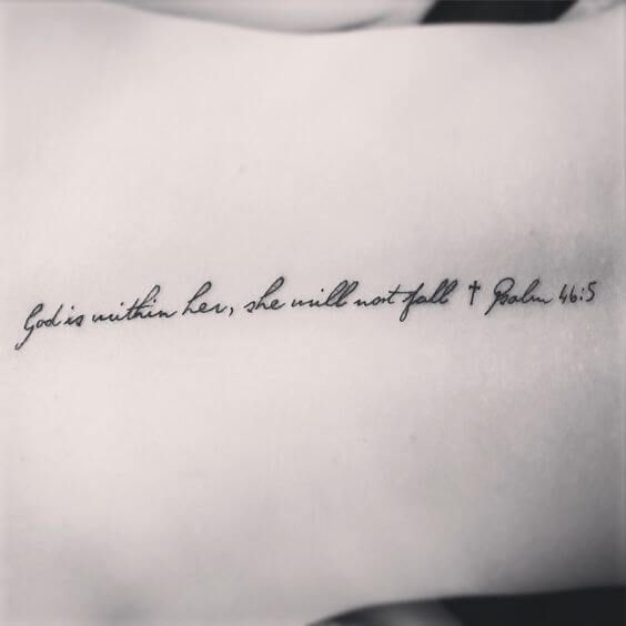 a black and white photo of a person's arm with a quote on it