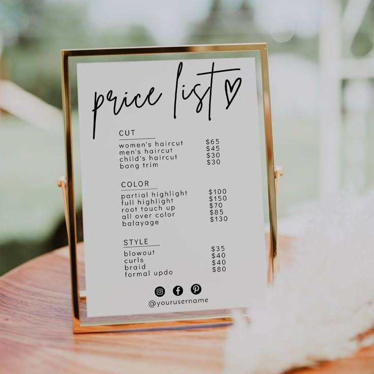 a price list sitting on top of a wooden table