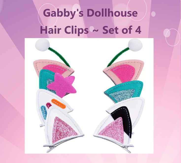 a pair of pink and blue hair clips on top of each other in front of a purple background