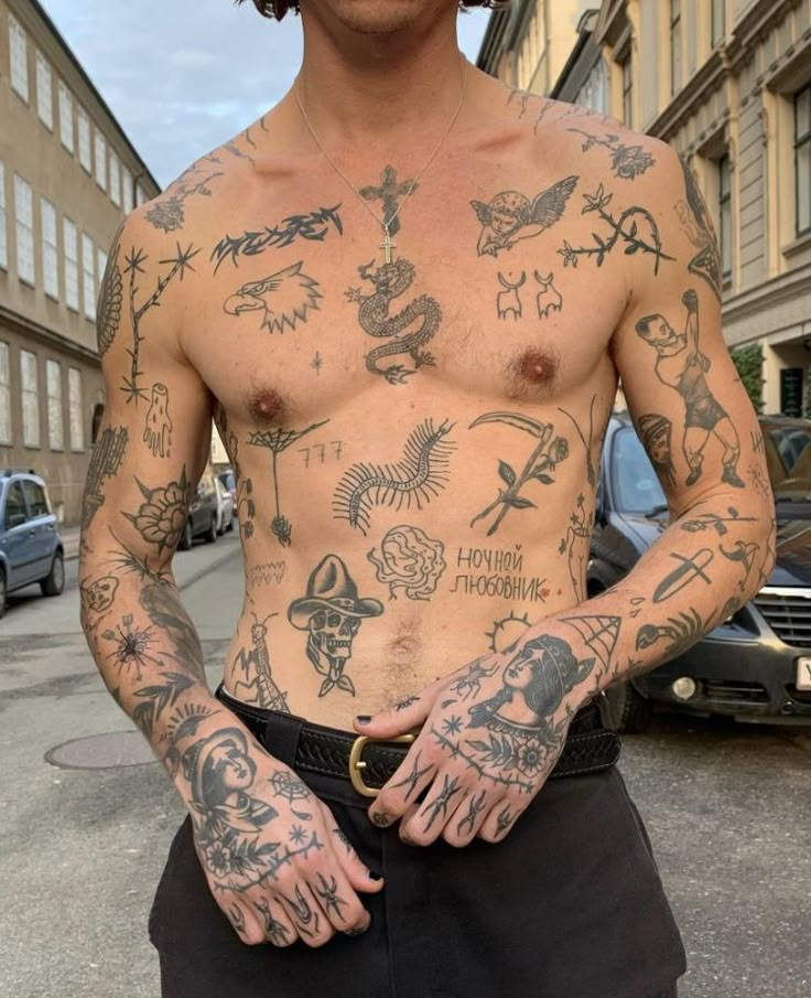 a man with many tattoos on his chest