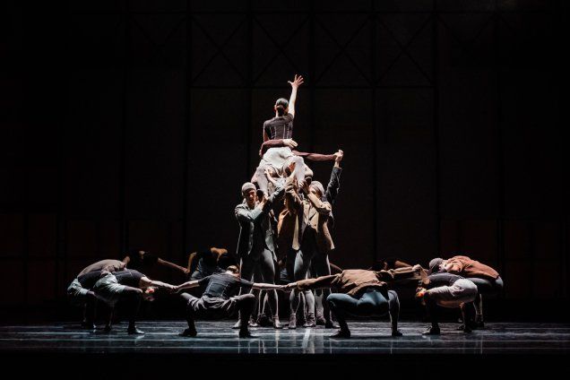 a group of people standing on top of a stage