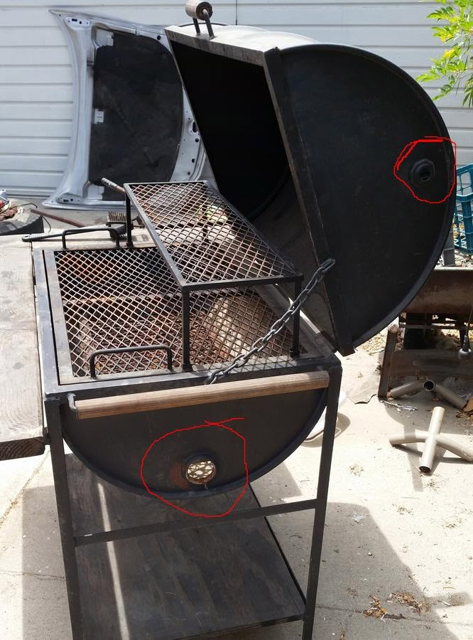 an outdoor grill is shown with red marks on it