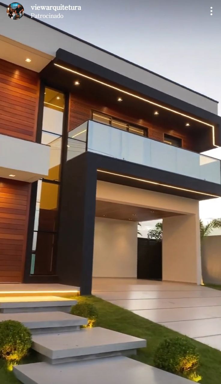 a modern house with stairs leading up to it