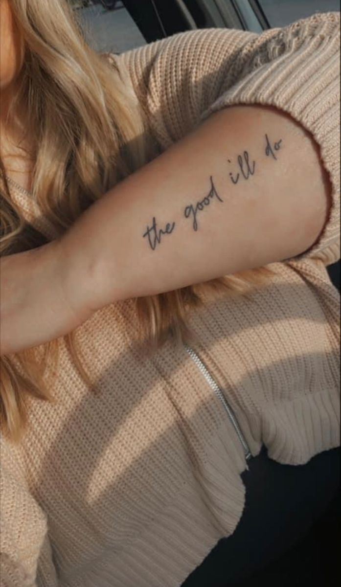 a woman with a tattoo on her arm that says, the good will be