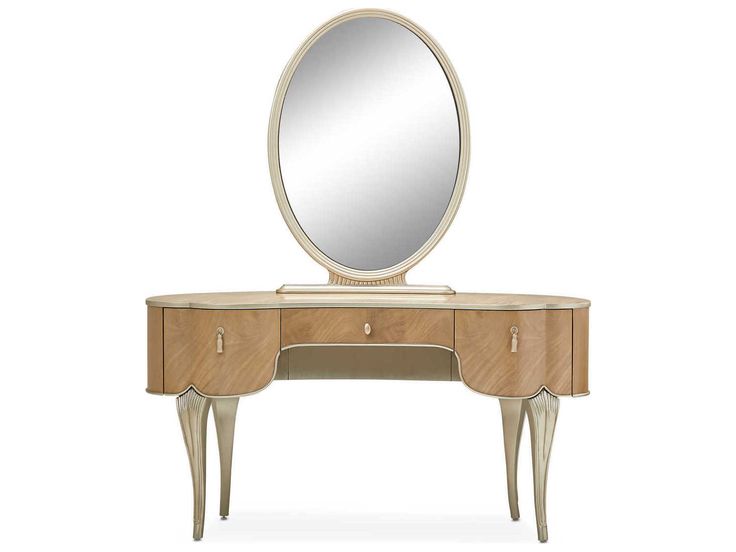 an oval mirror on top of a wooden vanity with two drawers and a drawer underneath it