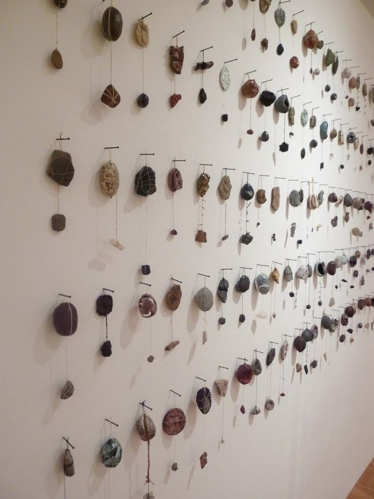 the wall is filled with many different types of objects hanging on it's sides