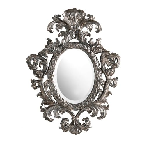 an ornate mirror is shown against a white background