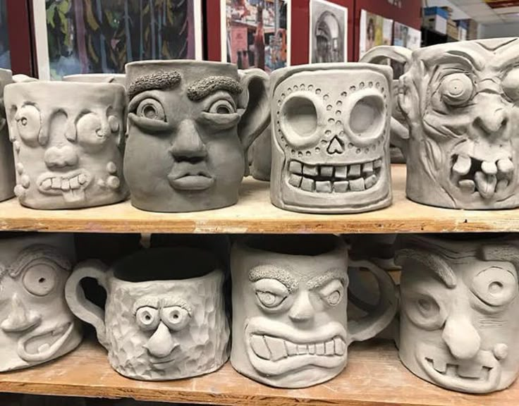 many mugs with faces are on display