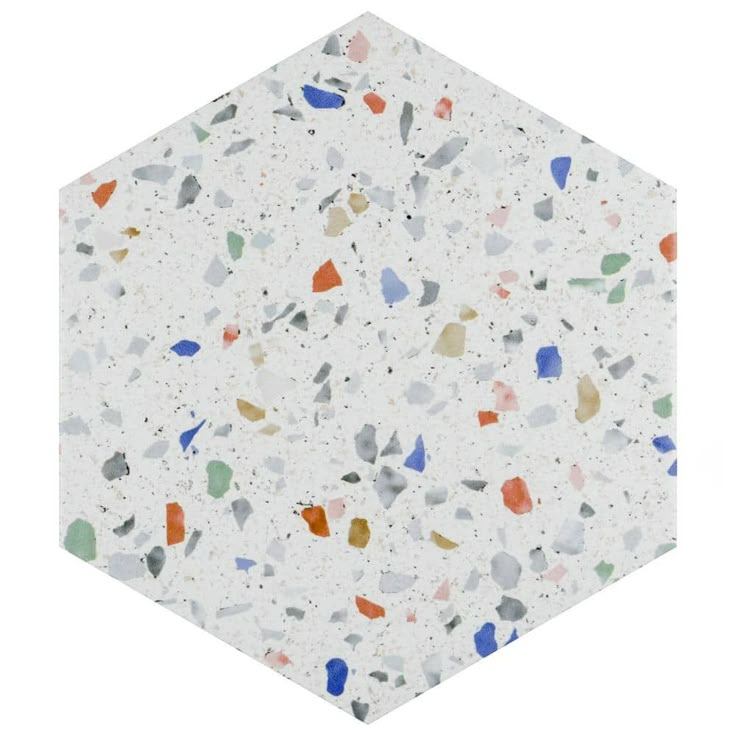 a white hexagonal tile with multicolored speckles