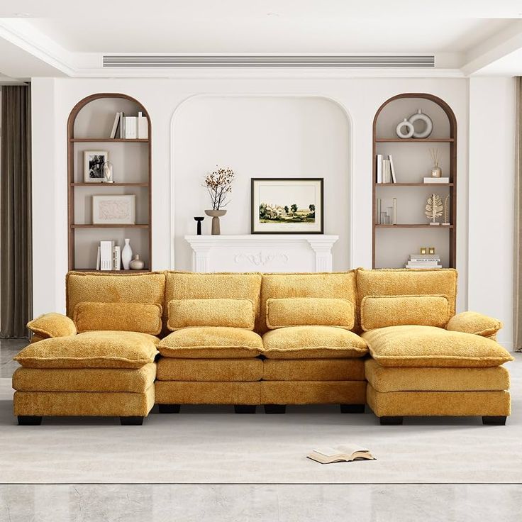 a large yellow sectional sofa in a living room