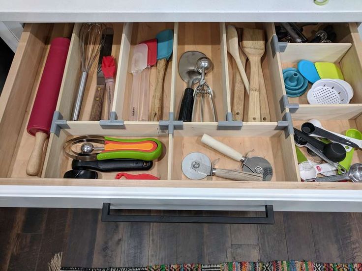 an organized drawer with utensils in it