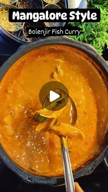 a pan filled with lots of food on top of a stove next to other cooking utensils