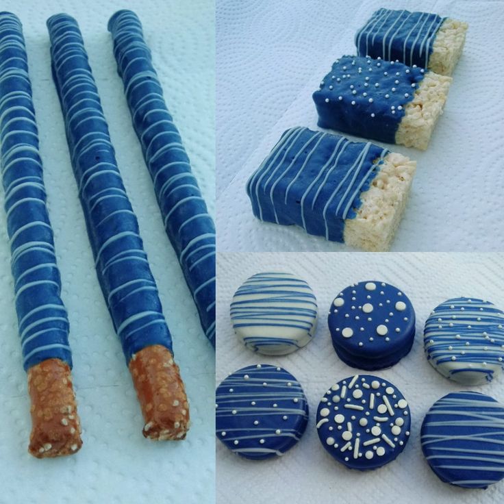 blue and white decorated cookies are on display