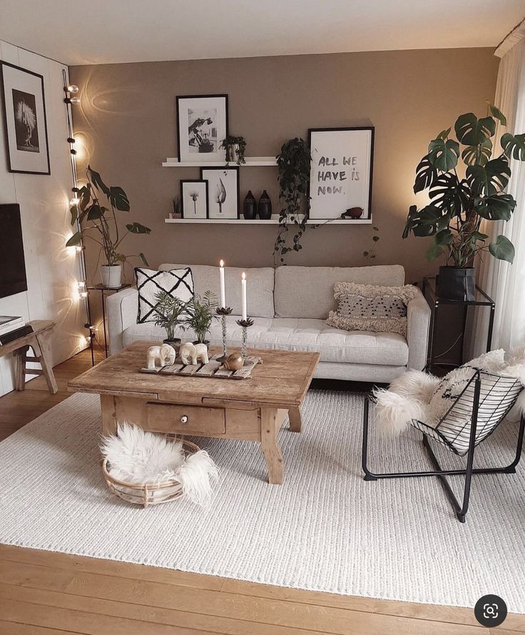 a living room filled with furniture next to a white rug on top of a hard wood floor