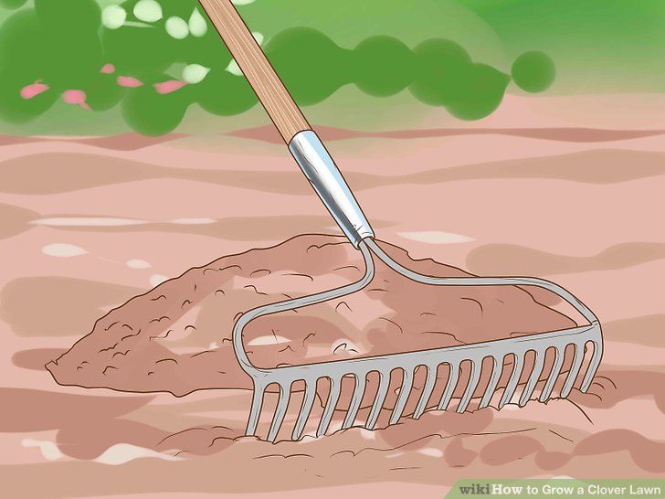 a shovel is laying in the ground with dirt on it and grass growing behind it