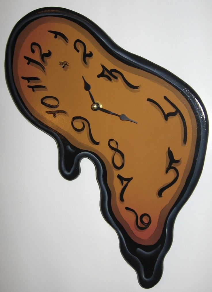 a clock that is on the side of a wall with numbers and letters painted on it