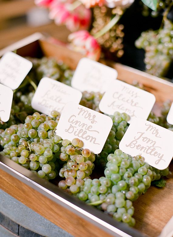 grapes are on display in a metal tray