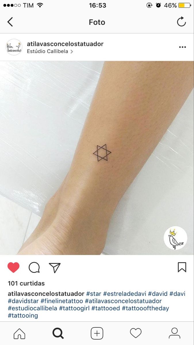 a person with a small star tattoo on their left arm and the word tattoos written in black ink