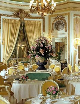 a fancy dining room with tables and chairs