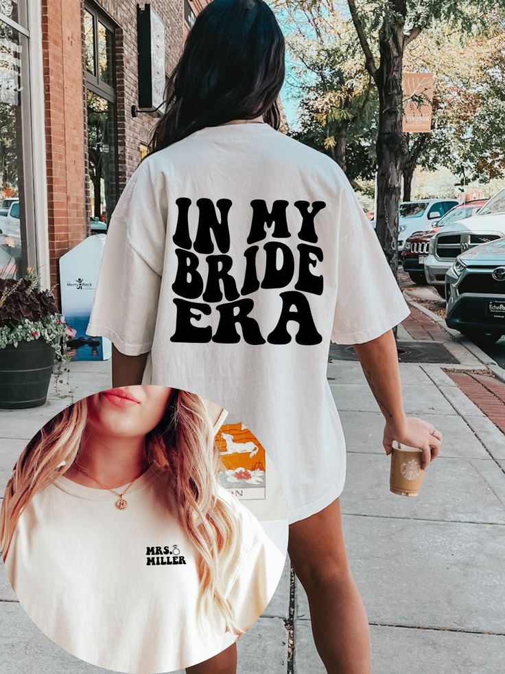 In my Bride Era Comfort  Colors Shirt 👰 Step into your bridal era with style in our Bride Era Shirt! 👰 Are you a bride-to-be ready to embrace every moment of your journey down the aisle? Our custom shirt is the perfect way to celebrate your bridal era and let the world know you're glowing with excitement. Crafted with care and attention to detail, our shirt is a stylish and sentimental addition to your wedding festivities. What makes our shirt truly special is its personalized touch - simply p In My Bride Era Shirt, In My Bride Era, Bride To Be Outfit Ideas, Bride Tshirt Ideas, Bride Shirt Ideas, Bride To Be Outfit, Bride Shirts Bachelorette, Gifts For Bride To Be, Bridal Era