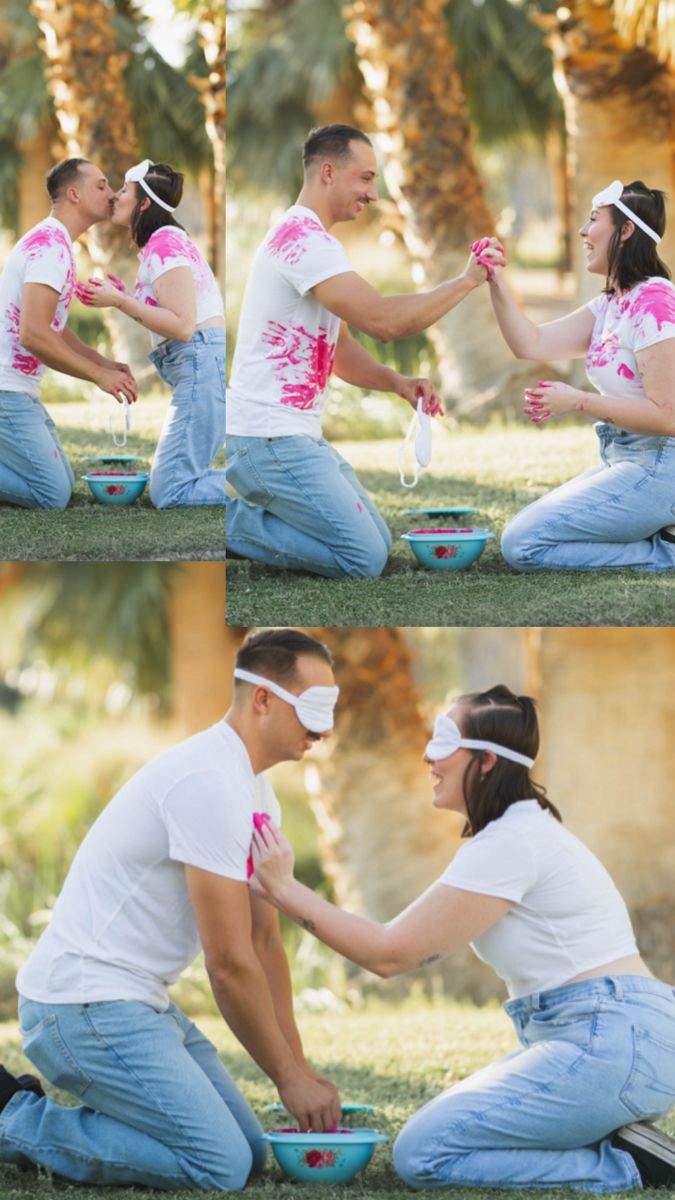 two people sitting on the ground touching each other