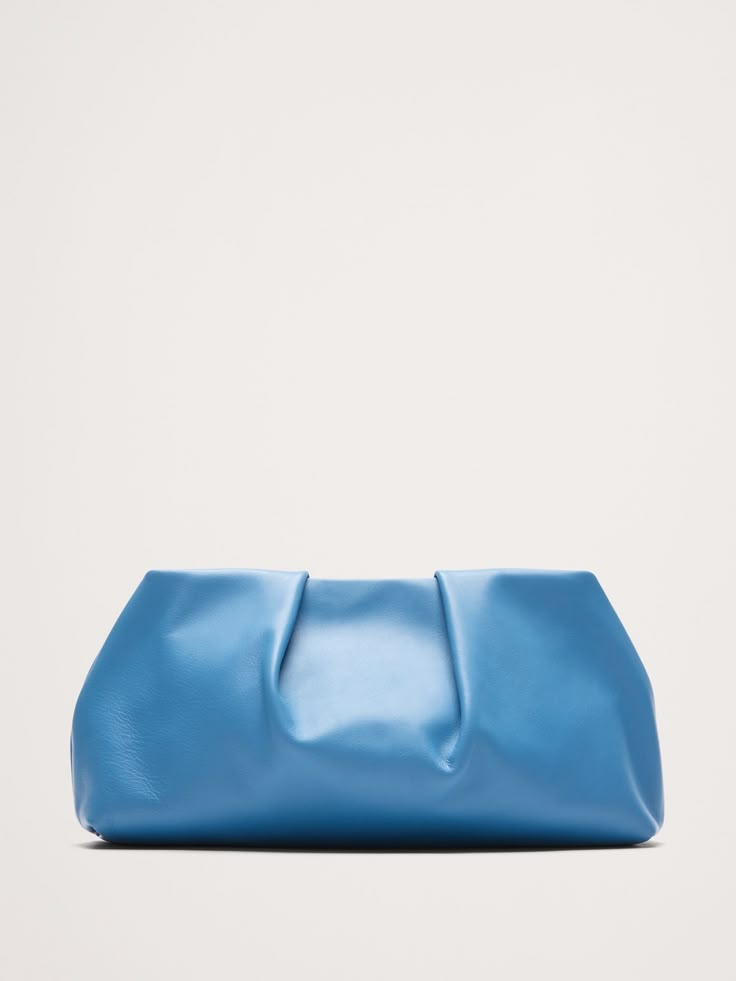 We designed this cloud-shaped clutch to carry you through every occasion for years to come, crafted here from beautiful leather to emphasize a distinctive pleated construction.  Magnetic clasp closure.  Fully lined.  Height: 6. 3" Width (base): 12. 8" Width (top): 10. 5" Depth: 2. 75" Woolen Tights, T Bar Shoes, Burgundy Style, Blue Clutch, Black Pantyhose, Faux Leather Belts, Family Event, Leather Clutch Bags, Hip Bag