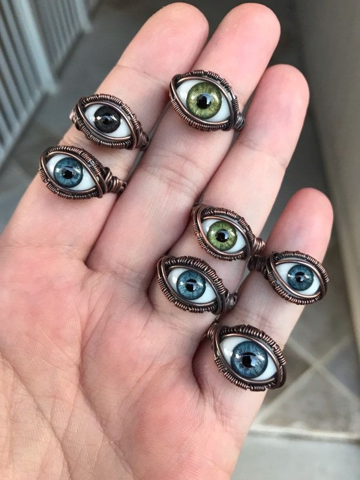 Custom fit and made to order wire wrapped glass eye ring Hand wrapped with raw copper wire that has been antiqued for a rustic look. These eyes have a flat back, uniform iris and pupil size, and a high quality leaded crystal dome.  Glass blown and do not break easily. This piece of jewelry is durable for everyday wear and made to last. Don't know your ring size? You can visit http://www.ringsizes.co/ for a conversion chart, all sizes I make are US size. *If you see that I'm out of stock of the e Oddities Jewelry, Jewelry Evil Eye, Dark Jewelry, Ring Wire, Realistic Eye, Wire Wrapped Ring, Evil Eye Ring, Dope Jewelry, Virginia Beach Va