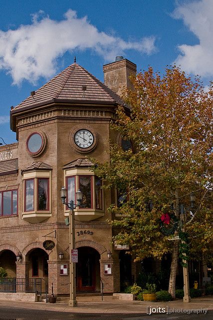 an old building with a clock on the front