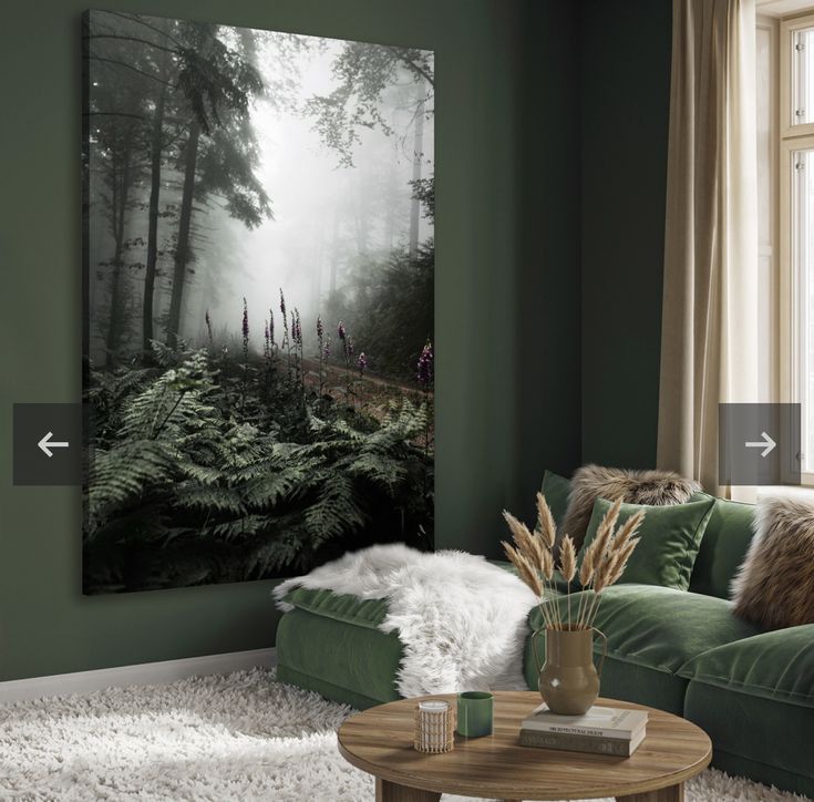 a living room filled with furniture and a painting on the wall above it's coffee table