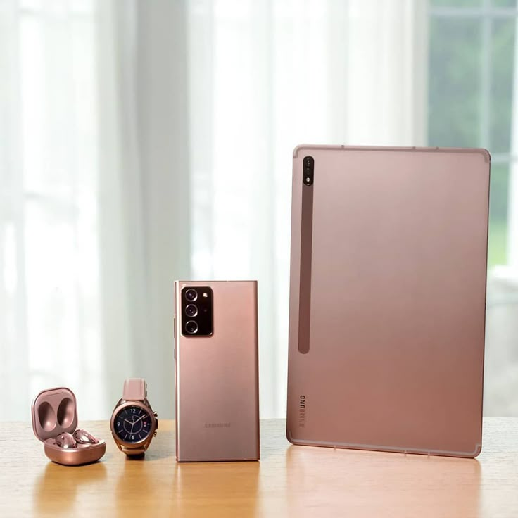 two different models of the new samsung foldable smart phone, one pink and one rose gold