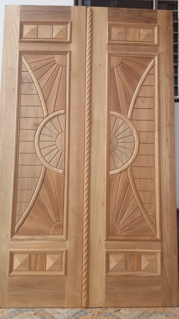 two wooden doors with intricate designs on the front and side panels, both made out of wood