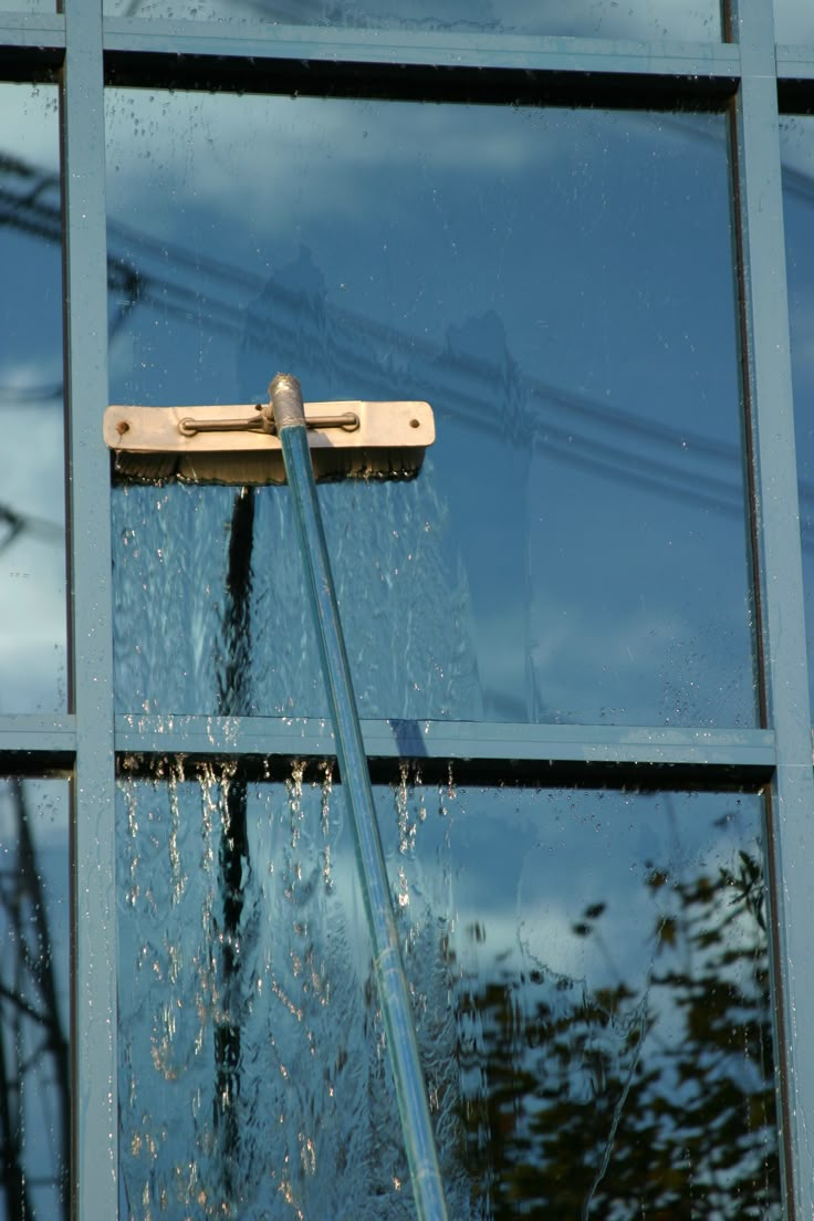 the window is being cleaned with a brush