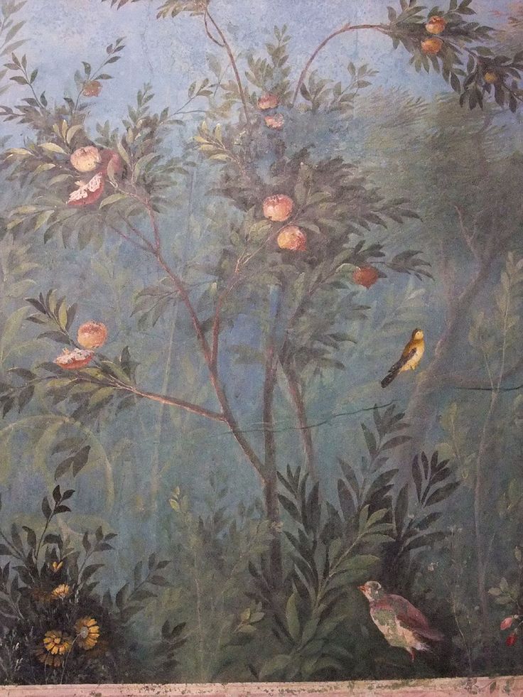 a painting with birds and flowers painted on the side of a wall in a room