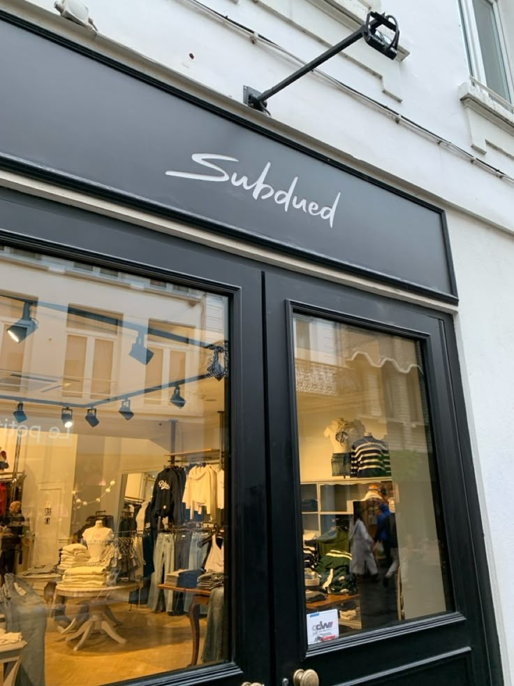 a store front with black doors and windows that say sudbaked on the side