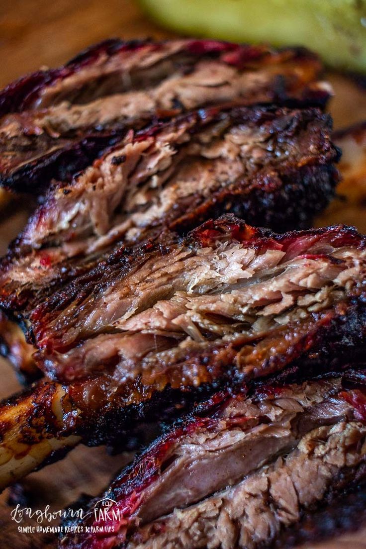 grilled beef ribs on a cutting board with text overlay